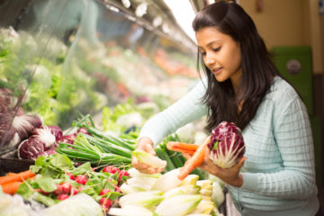 Indian girl shopping for vegetables