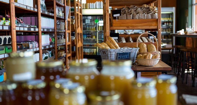 An organic store stocked with organic foods and products, including organic honey, ghee, bread, etc