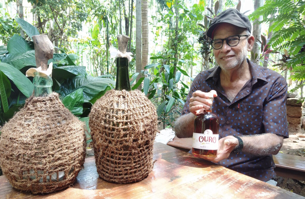 Proprietor Ajit Malkarnekar with Garafaos of OURO Spiced Feni -Goa Heritage Distillery-Pure & Eco India